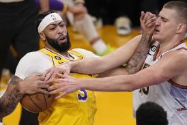 Anthony Davis (l) must contain Nikola Jokic (r) as the Lakers and Nuggets meet in the NBA playoffs. (AP PHOTO)