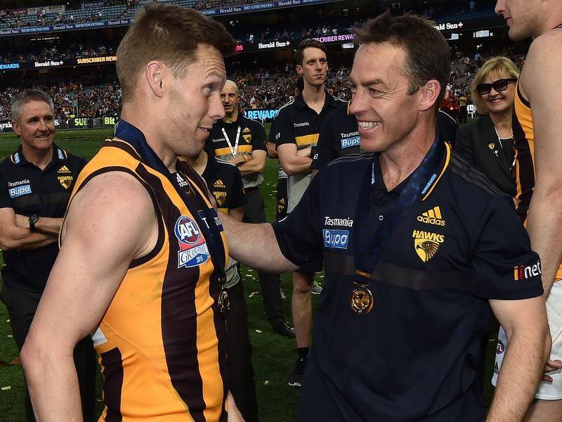Sam Mitchell (l) and Alastair Clarkson after Hawthorn's AFL premiership win in 2015.