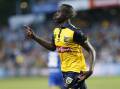 Alou Kuol has heaped praise on the coach who's guided the Central Coast Mariners to the premiership. (Darren Pateman/AAP PHOTOS)