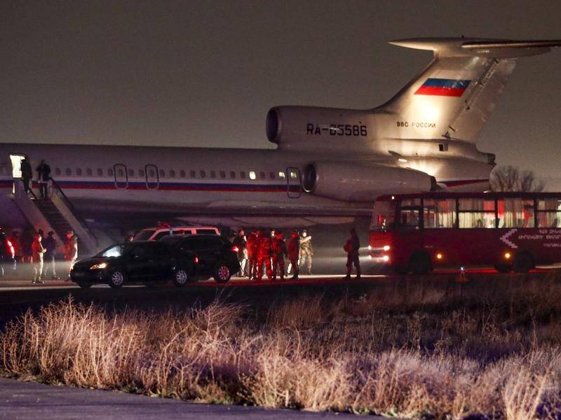 A Russian military plane has brought Armenian captives to Yerevan as part of a swap with Azerbaijan.