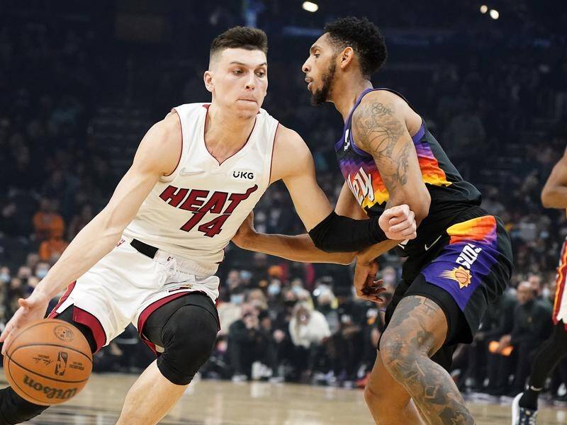 Tyler Herro (l) led the way as the Miami Heat thrashed the Phoenix Suns in an NBA upset.