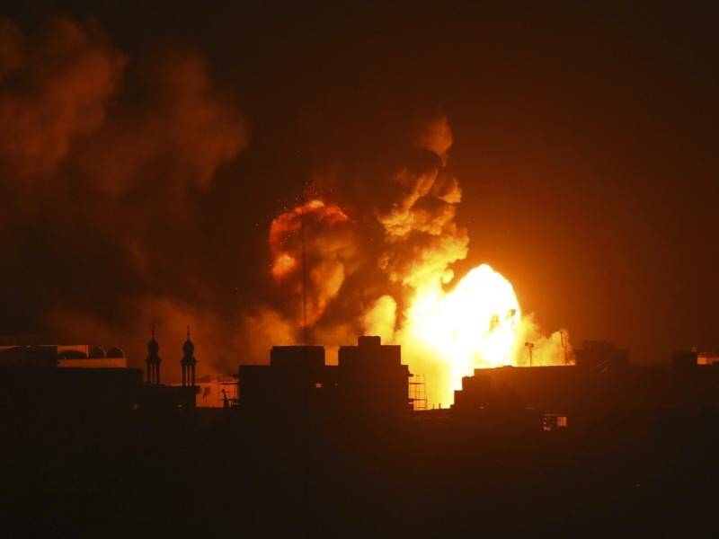 Fire and smoke rises from buildings following Israeli airstrikes on Gaza City. (AP PHOTO)