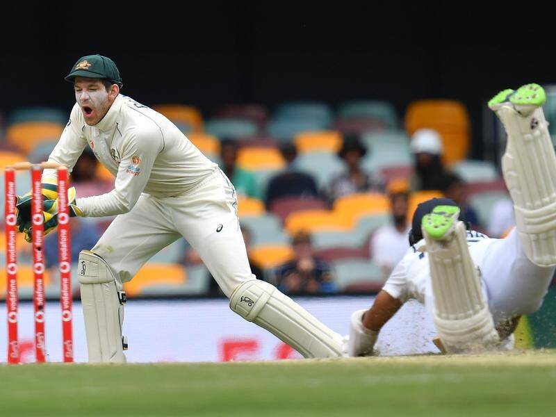 Tim Paine (l) says he has unfinished business as Australia Test skipper.