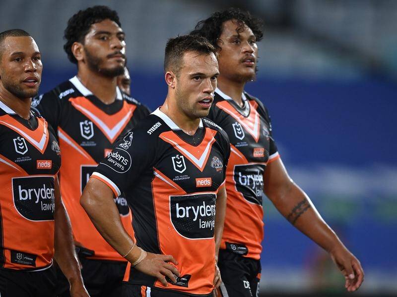 Luke Brooks says he is determined to see out his contract with struggling NRL club Wests Tigers.