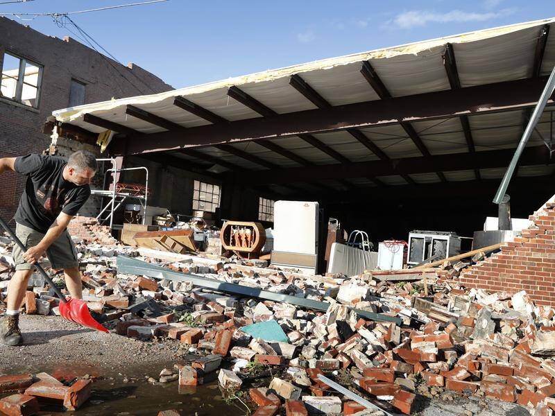 Walls collapsed, roofs were blown off buildings and an historic courthouse tumbled to the ground.