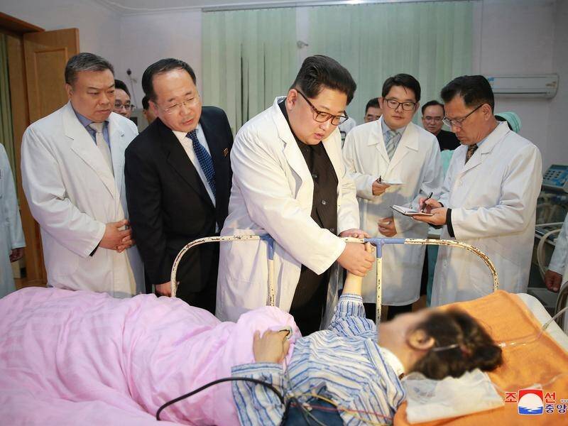 North Korean leader Kim Jong-un visits survivors of a bus crash which killed 32 Chinese tourists.