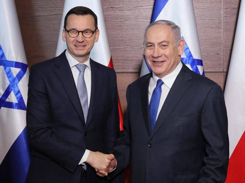 Polish Prime Minister Mateusz Morawiecki (left) will not travel to Israel this week.