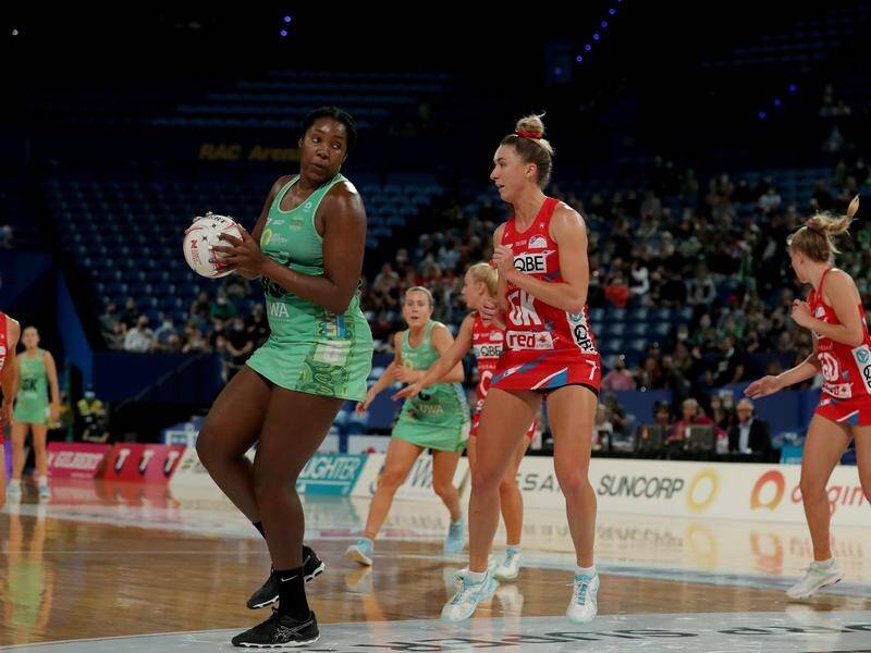 Jhaniele Fowler (l) in action for West Coast Fever as they beat NSW Swifts 63-55 in Super Netball.