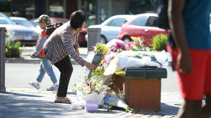 Flowers left in Sunshine in tribute to Ms Warzywoda.  Photo: Angela Wylie