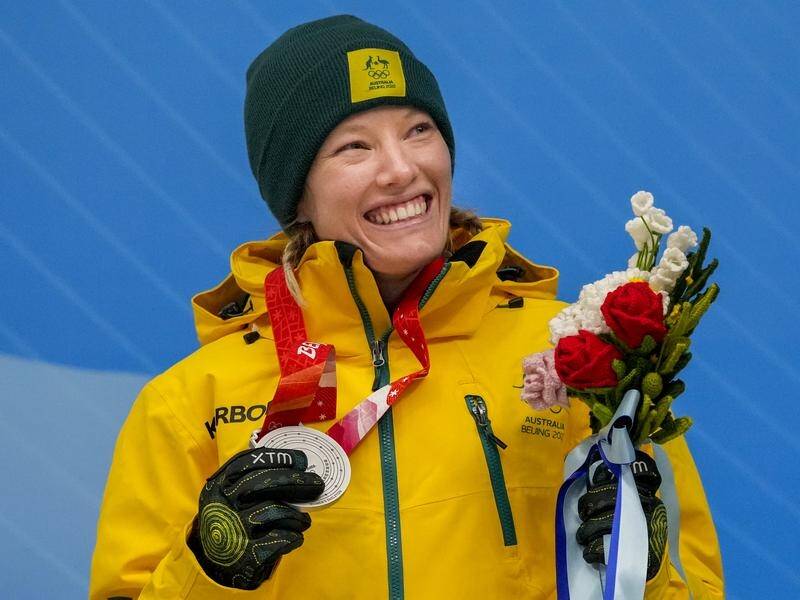 Jackie Narracott clutches Australia's first sliding medal, a skeleton silver, at a Winter Olympics.