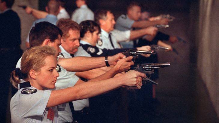 A policewoman pictured with colleagues at a pistol range in 1995. Photo: Dominic O'Brien