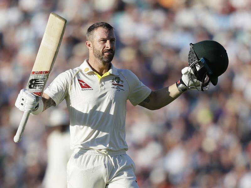 Australia's Matthew Wade celebrates scoring a century during the fifth Ashes test against England.