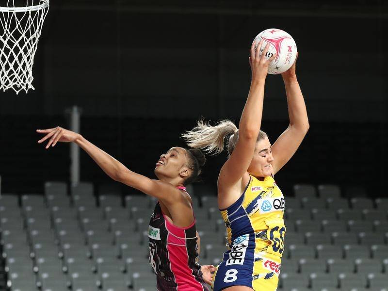 Sophie Garbin of the Swifts (r) takes possession during her side's win over the Thunderbirds.