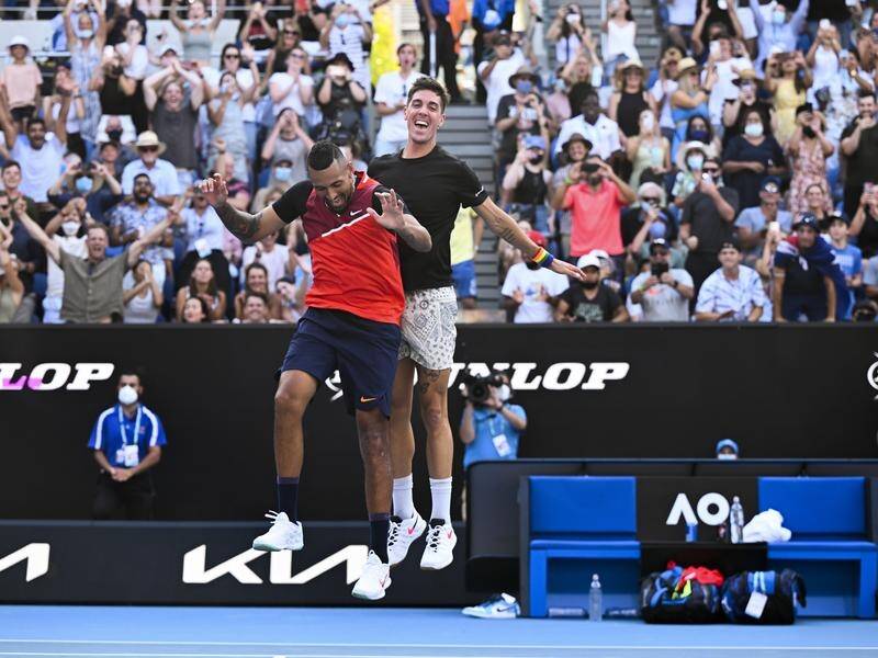 Thanasi Kokkinakis (right) and Nick Kyrgios celebrate their third-round Australian Open doubles win.