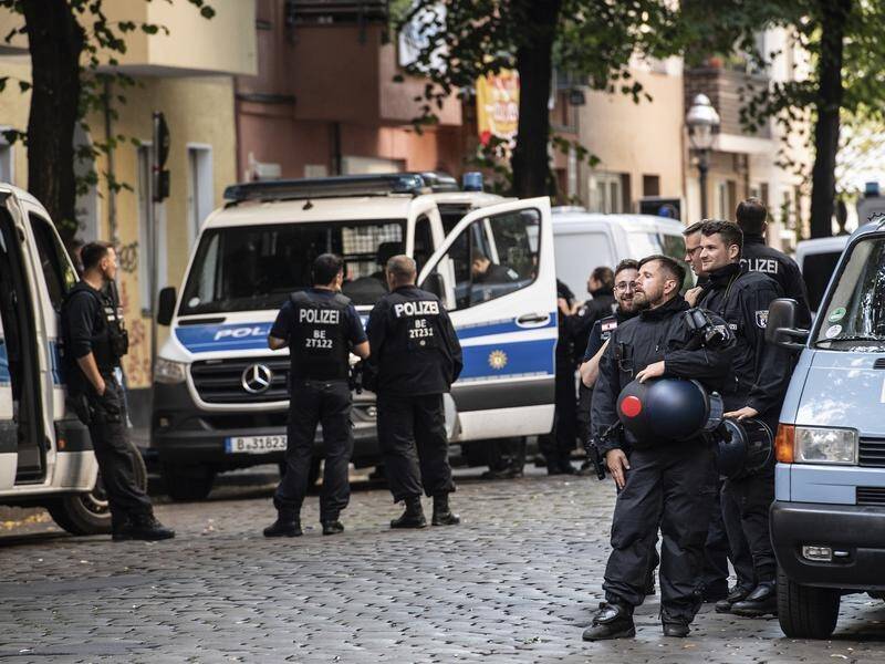Police in Berlin oversee the protested eviction of a left-wing bar.