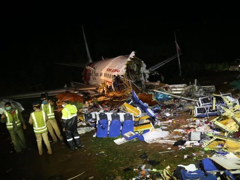 Two pilots are among those killed when a plane skidded off a hilltop runway in India's south.