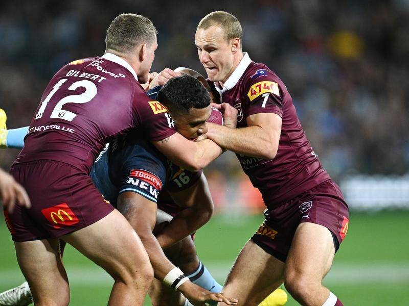 Queensland's Tom Gilbert (l) dislocated his shoulder in the first half of Origin 1 at Adelaide Oval. (Joel Carrett/AAP PHOTOS)