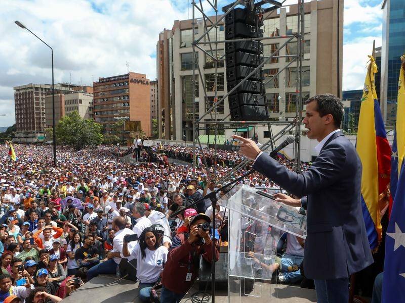 Venezuelan opposition leader Juan Guaido says he will assume all the powers of the presidency.