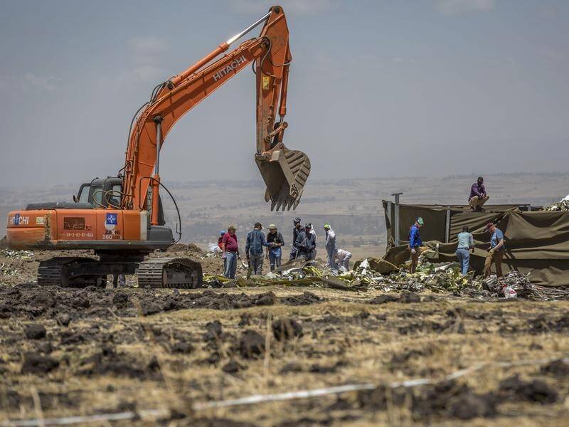 Families are being given soil from the site where an Ethiopian plane crashed.