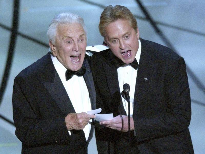 Hollywood is remembering Kirk Douglas (L) who has died aged 103, his son Michael announced.