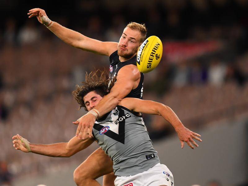 Harry McKay (top) and Lachlan Jones contest the ball during Port Adelaide's win over Carlton.