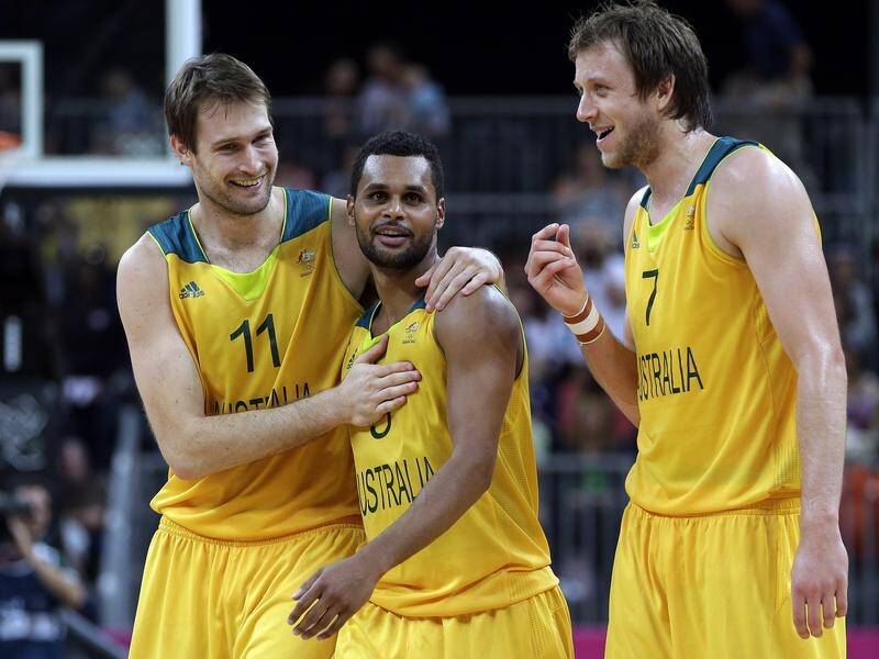 Mark Worthington (l) with Patty Mills (c) and Joe Ingles durign the 2012 Olympics in London.