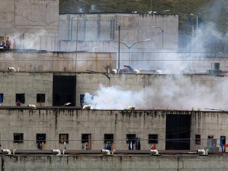 Dozens of people have been killed in coordinated prison riots in Ecuador.