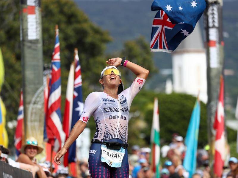 Australian Sarah Crowley celebrates after placing third at the Hawaiian Ironman event.