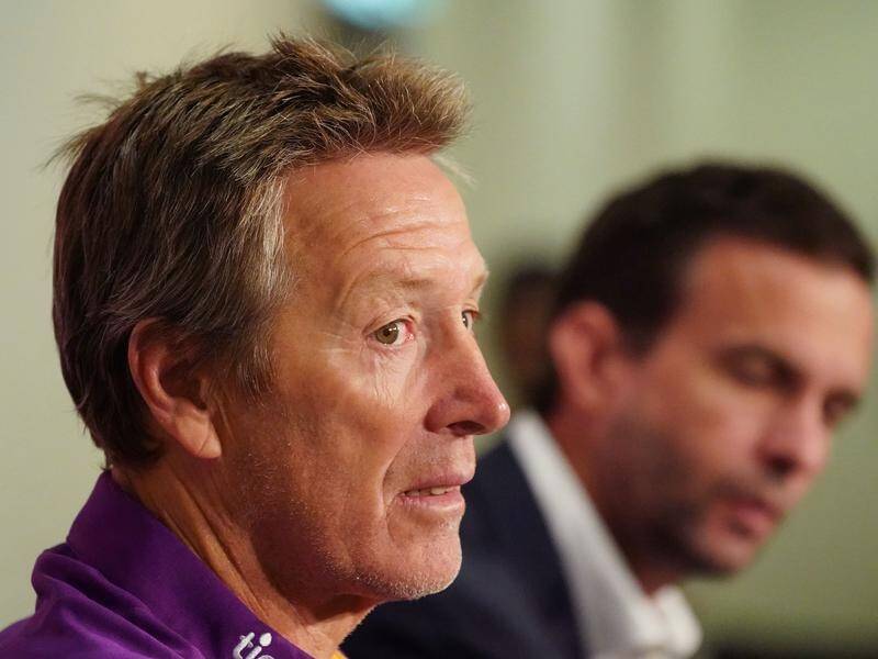 Melbourne Storm coach Craig Bellamy will take a pay cut to help preserve jobs at the NRL club.