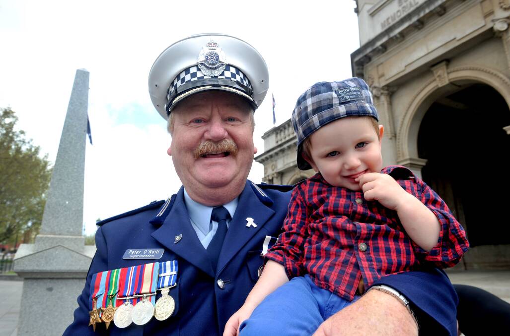 National Police Remembrance Day held in the RSL's forecourt, Pall Mall. 
Superintendent Peter O'Neill and his 2 year old grandson Ethan Crocker.


Picture: JULIE HOUGH
28.09.13