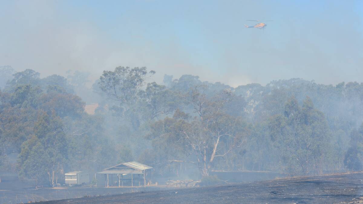 The CFA along with air support fight the fire in Lyell Road fire in Lyal, near Redesdale.

Picture: JIM ALDERSEY
