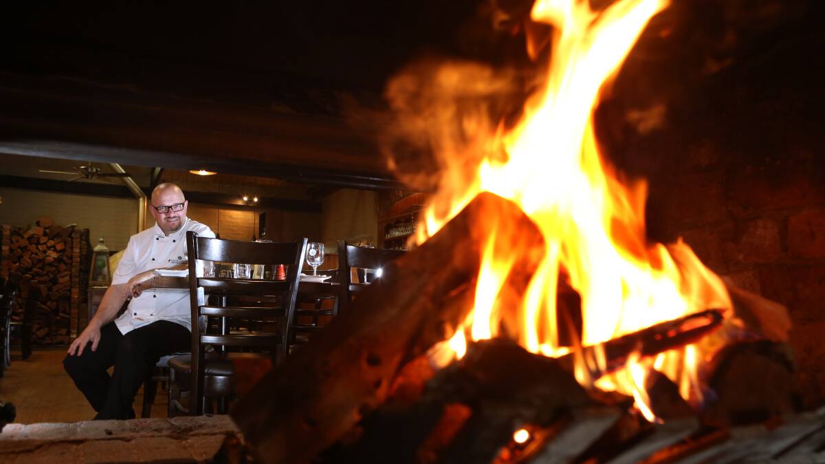 On fire: Woodhouse chef Paul Pitcher cooks all his meat with red gum. Picture: PETER WEAVING