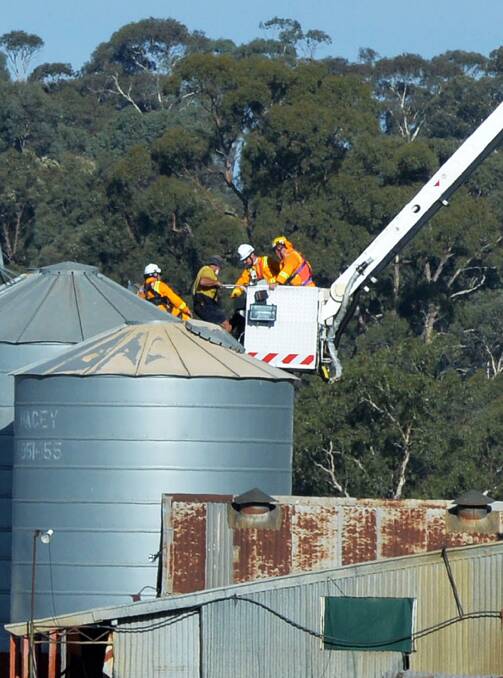 Rescue: CFA members extract the man. Picture: BRENDAN McCARTHY