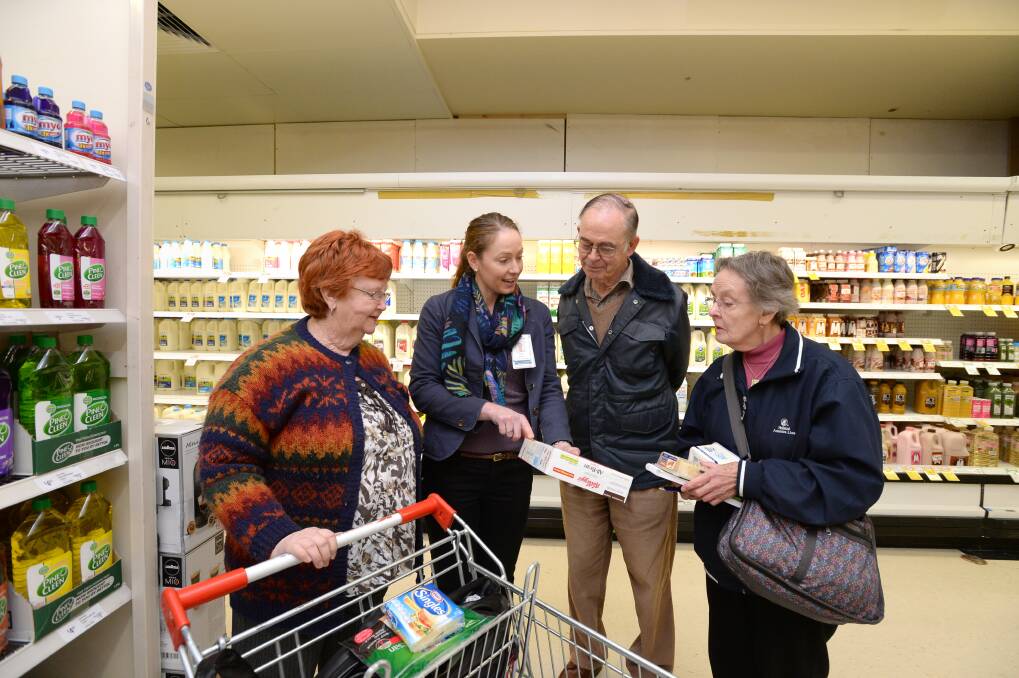 INFORMATIVE: Community dietitian Bree Forrester (centre) leads tour participants through the supermarket. Picture: JIM ALDERSEY
