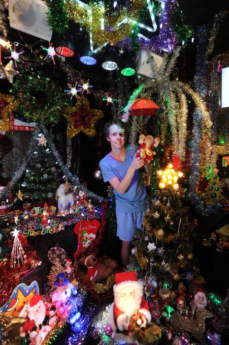 SPARKLING: Joshua Maggs shows off his Christmas wonderland. Picture: JODIE DONNELLAN