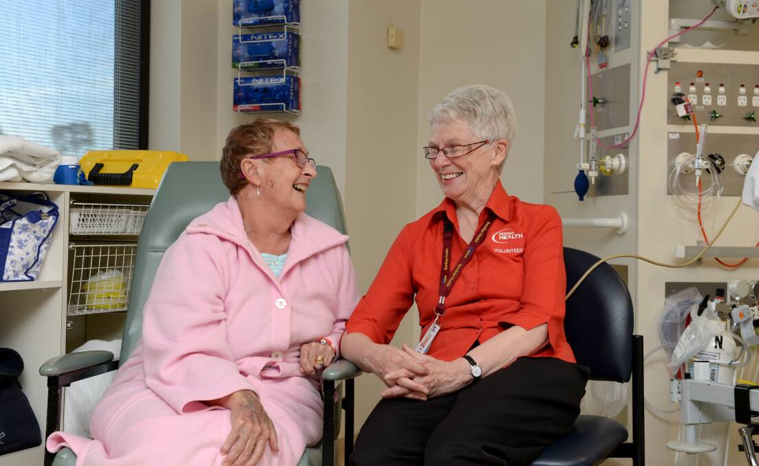 SUPPORT: ICU patient Elaine Harwood with volunteer Helen Wood. 
