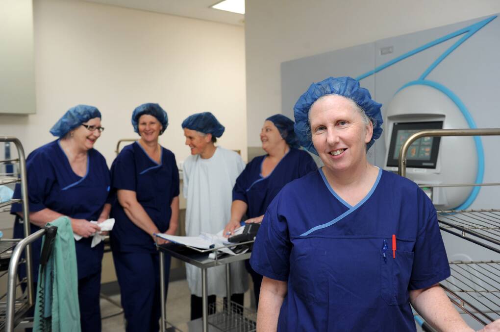 AT WORK: Ann Gallagher with her team of staff at the Bendigo Health. Picture: JODIE DONNELLAN