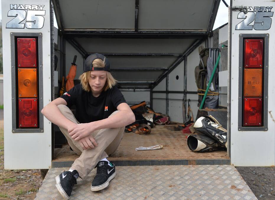 UNHAPPY: Harry Smith sits in his empty motorbike trailer. Picture: BRENDAN McCARTHY
