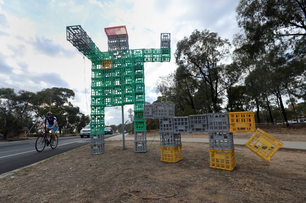 HE'S BACK: Crate Man and his dog. Picture: JIM ALDERSEY