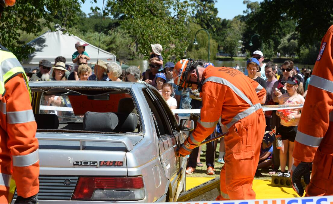DEMONSTRATION: SES show crowd at Lake Weeroona how they use the jaws of life . Picture: LIZ FLEMING
