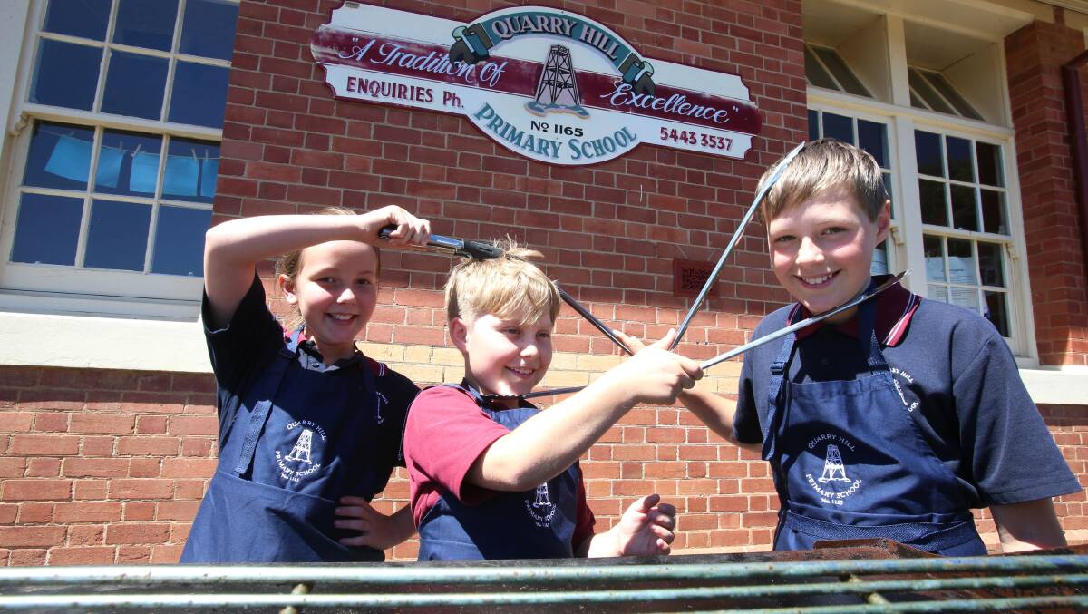 TONGS: Quarry Hill Primary School students Abbi Scherger, Sam Martin and Liam Duivenvoorden will be among many to raise funds for a cause on election day by hosting a polling station. Picture: PETER WEAVING