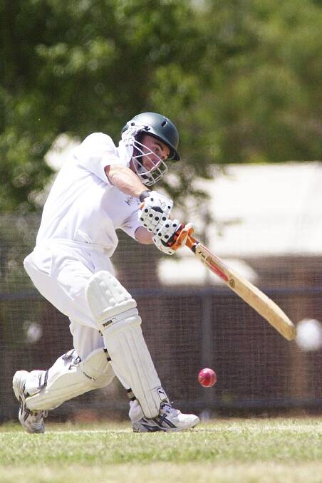 Gisborne's Glenn Warner drives in the match against Benalla at Weeroona Oval in 2005. 