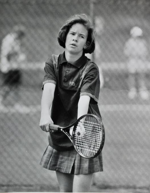 Casey Fitzgerald prepares to serve in a match at the Bendigo Lawn Tennis Club. 