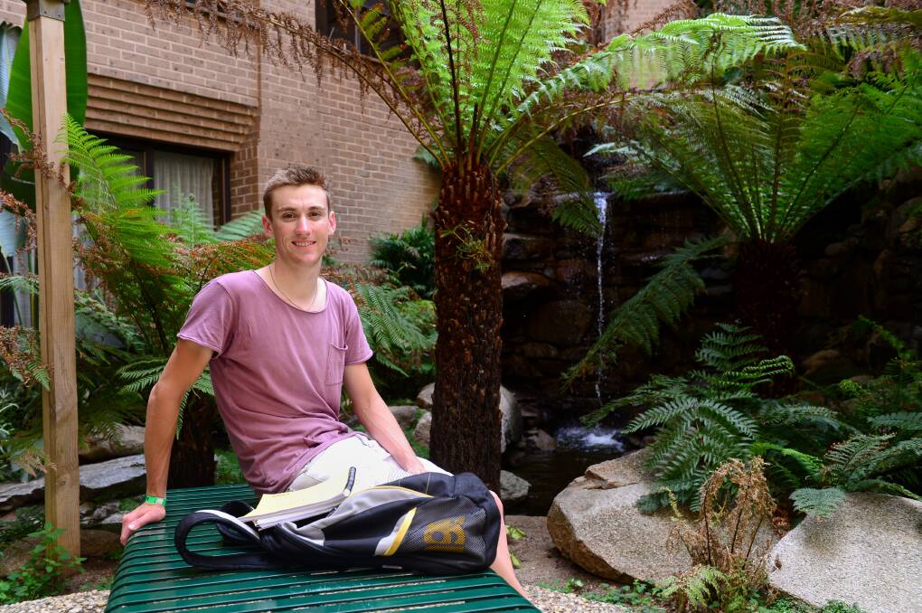 TIME OUT: Cycling star and first-year nursing student Sam Crome takes a break during Monday's classes at La Trobe University Bendigo. Picture: JIM ALDERSEY