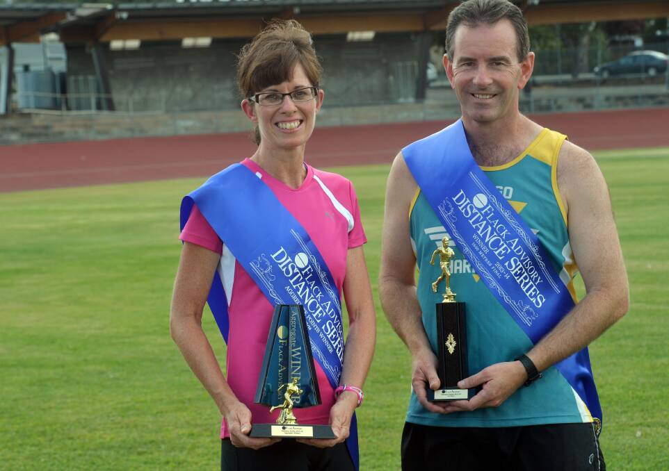 TOP HONOURS: Mandy Worthington and Geoff Jordan with their Flack Advisory distance series trophies. Picture: BRENDAN McCARTHY