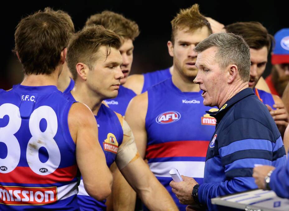 TALKING TACTICS: Western Bulldogs coach Brendan McCartney at a quarter-time huddle during this year's AFL action. Picture: GETTY IMAGES