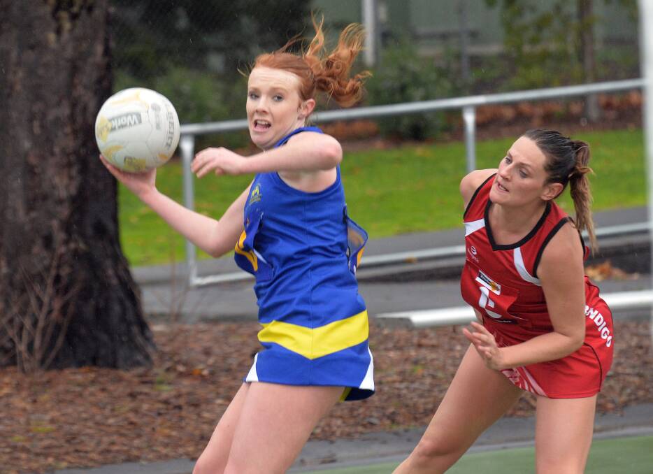 ATTACK: Golden Square centre Ashley Ryan prepares to fire a pass in Saturday's A-grade netball match against South Bendigo on the QEO court. Picture: BRENDAN McCARTHY