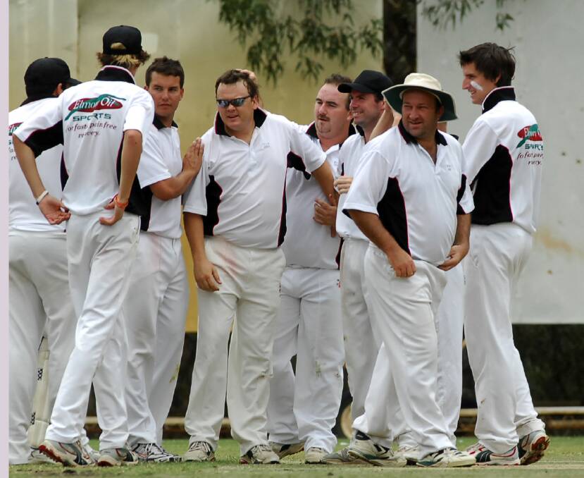 Nick Patten is congratulated by Emu Valley team-mates after taking a wicket against Gisborne in 2007 at Strathdale's Bell Oval. 