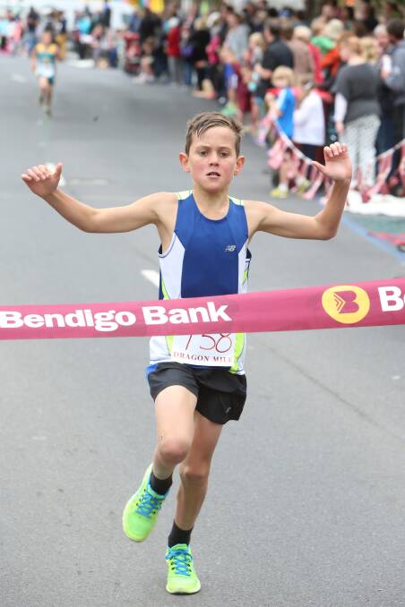 Spring Gully Primary School's Jack Meade win the grade 5-6 boys race in the Bendigo Bank Dragon Mile. 