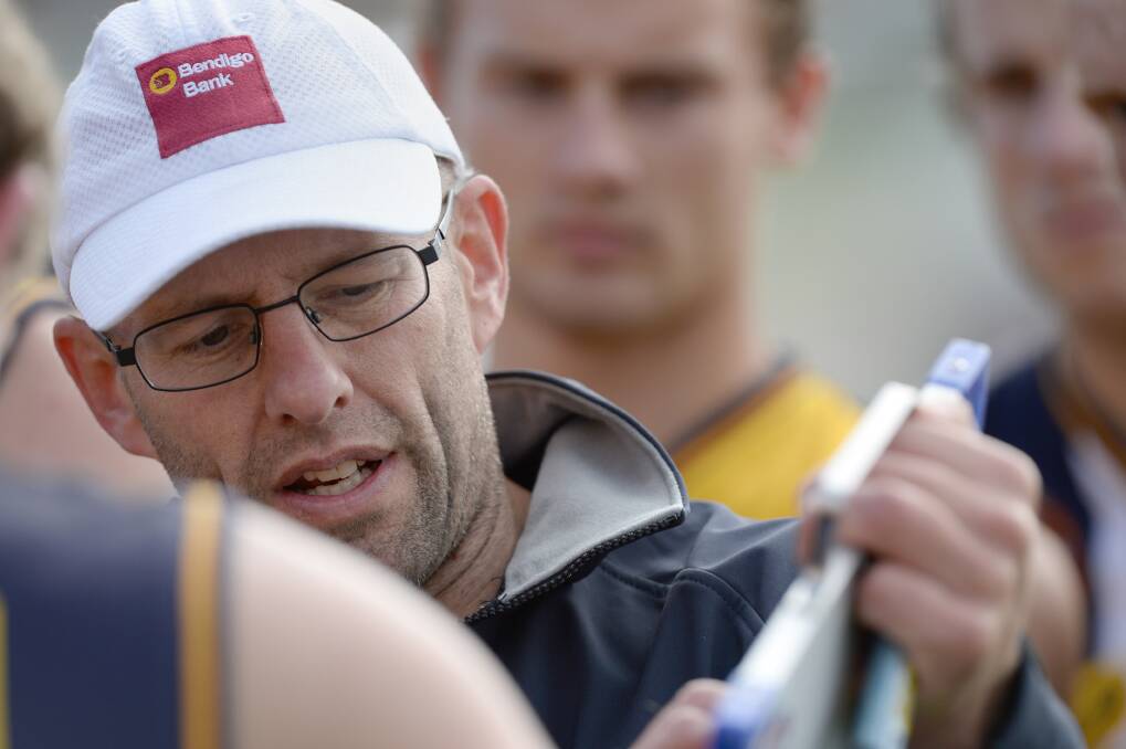 Bendigo Senior Secondary College coach David Newett points out some positional moves in the Lions pool win against CCB. 